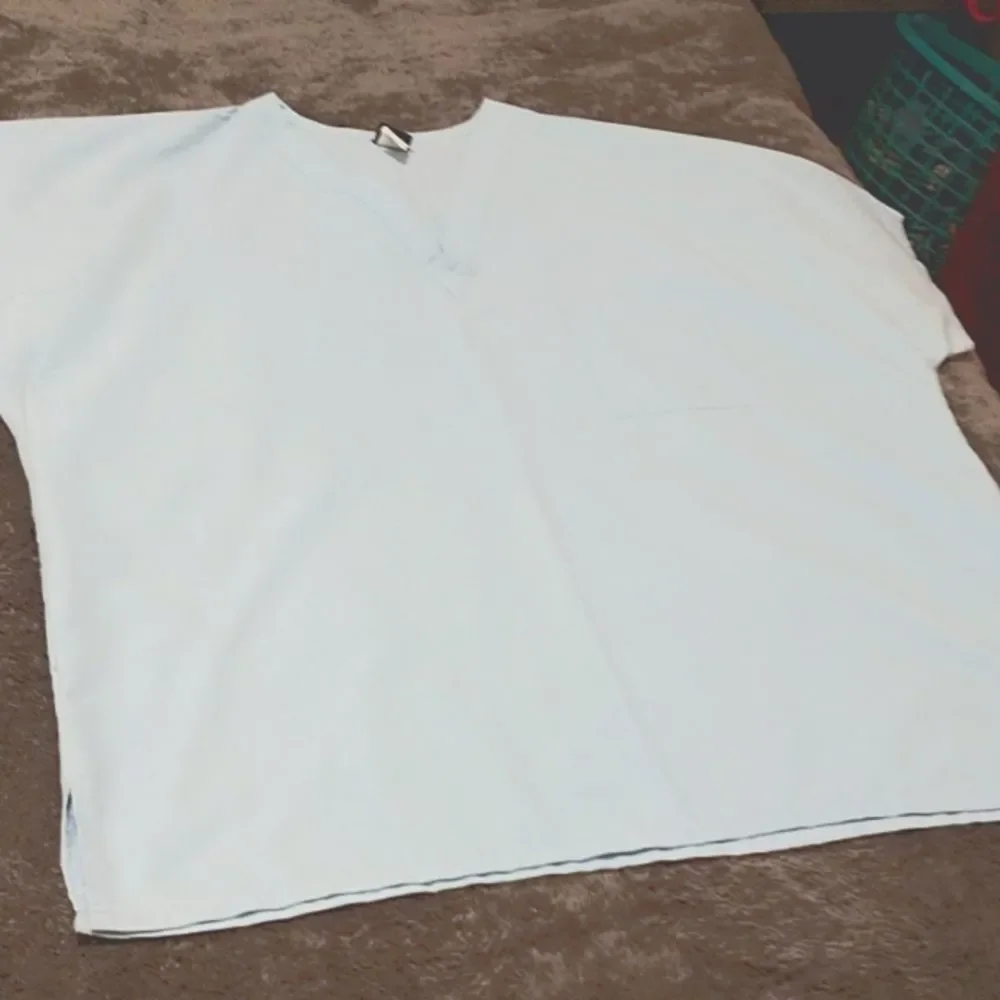 π3/$12 Light teal colored scrub top! - Picture 1 of 6